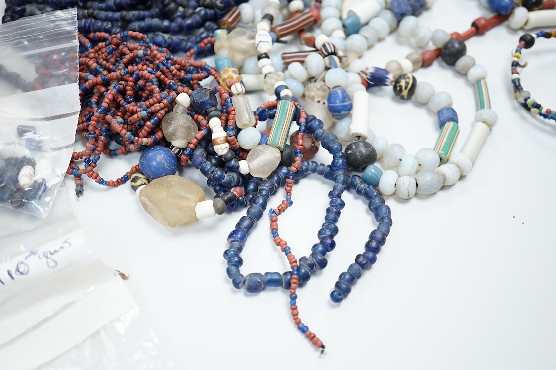 A pair of Turkish bath shoes, a collection of African beads and Middle Eastern vessels etc.